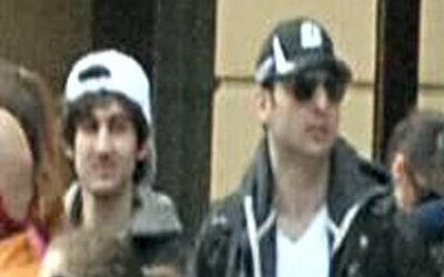 This photo released by the FBI shows the Tsarnaev brothers, with Tamerlan on the right, walking through the crowd in Boston on April 15, before the explosions at the Boston Marathon. (photo credit: AP/FBI)