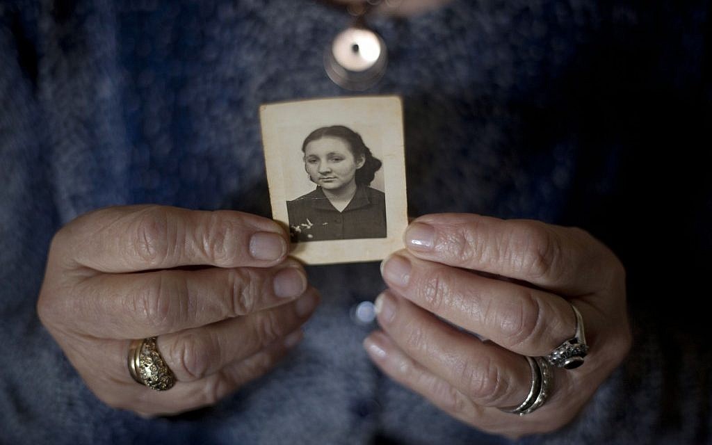 In this April 4, 2013 photo, Warsaw Ghetto Holocaust survivor Aliza Vitis-Shomron, nee Mendel, holds a photograph of herself when she was about 17 years old as she sits in her living room in Kibbutz Givat Oz, Israel. (AP/Ariel Schalit) In this April 4, 2013 photo, Warsaw Ghetto Holocaust survivor Aliza Vitis-Shomron, nee Mendel, holds a photograph of herself when she was about 17 years old as she sits in her living room in Kibbutz Givat Oz, Israel. (AP/Ariel Schalit)