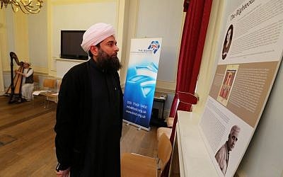 Sheikh Ibrahim Mogra views a new Board of Deputies display on righteous Muslims during the Holocaust. (photo credit: Marc Morris/courtesy)