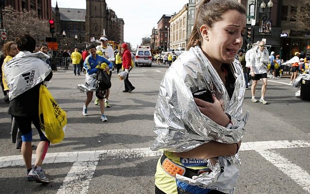 A runner leaving Copley Square after the bombing on Monday. (photo credit: AP/Winslow Townson)
