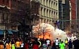 In this image from video provided by WBZ TV, spectators and participants run from the twin explosions that shook the finish line of the 2013 Boston Marathon. (Photo credit: AP/WBZTV)