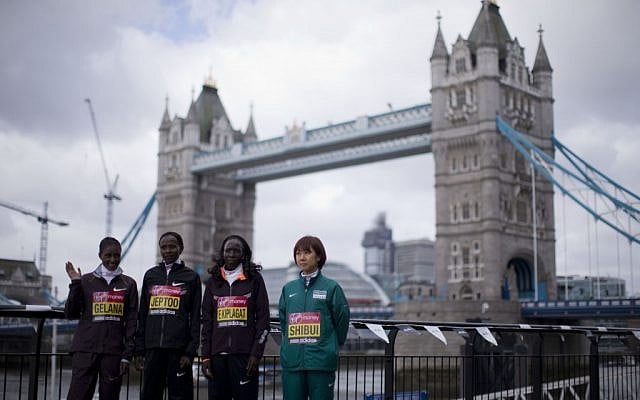 Runners pose for photographs during a media opportunity for the London Marathon back-dropped by Tower Bridge in London, Thursday, April 18, 2013. (photo credit: AP/Matt Dunham) Runners pose for photographs during a media opportunity for the London Marathon back-dropped by Tower Bridge in London, Thursday, April 18, 2013. (photo credit: AP/Matt Dunham)