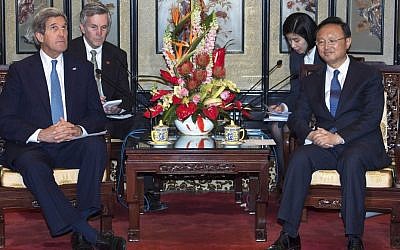 US Secretary of State John Kerry, left, meets with Chinese State Councilor Yang Jiechi in the Diaoyutai State Guesthouse Saturday, April 13, 2013 in Beijing (photo credit: AP/Paul J. Richards)
