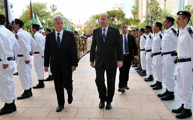US Defense Secretary Chuck Hagel, center left, walks with Defense Minister Moshe Ya'alon in Tel Aviv, April 2013 (photo credit: Ariel Hermoni/Israeli Ministry of Defense)