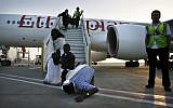 A Falash Mura man kisses the ground as the flight from Ethiopia lands at the airport in Israel in May 2008 (photo credit: Michal Fattal/Flash90)