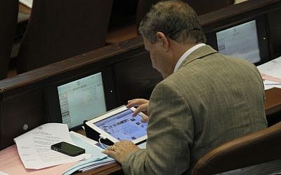 MK Meir Sheetrit surfing Facebook in the Knesset in 2011. (photo credit: Miriam Alster/Flash90)
