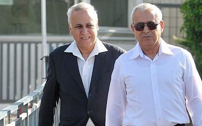 Moshe Katsav (left) leaving prison for his first home visit, May 2012. (Yossi Zeliger/Flash90)