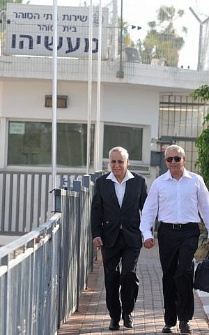 Former president Moshe Katsav, who is serving a seven-year sentence for rape, leaves Maasiyahu prison  to attend his son Noam's wedding last May. (Photo credit: Yossi Zeliger/FLASH90)