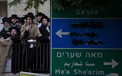 Thousands of ultra-Orthodox Jews holding a prayer rally in Jerusalem's Shabbat Square in opposition of the government's plan to start drafting yeshiva students into military and national service, June 25, 2012 (photo credit: Yonatan Sindel/Flash90)