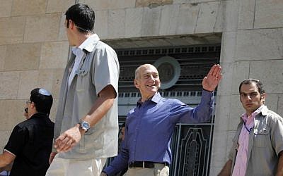 Former Prime Minister Ehud Olmert leaves Jerusalem District Court in July 2012 after he was cleared of charges of double-billing on trips abroad in the "Rishon Tours" case, and cleared of charges of illegally taking money from American businessman Morris Talansky. (Photo credit: Flash90)