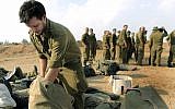 Illustrative: An Israeli reservist packs his gear after ending a deployment near Gaza during Operation Defensive Shield. (Tsafrir Abayov/ Flash90)