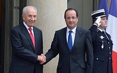 French President Francois Hollande, right, welcomes Israeli President Shimon Peres at the Elysee Palace in Paris on March 8. (photo credit: Moshe Milner/ GPO/Flash90)