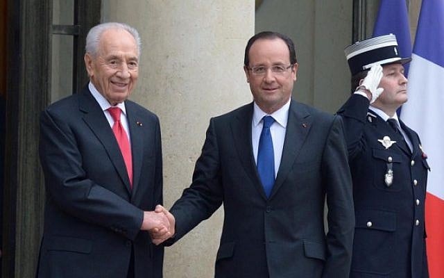 French President Francois Hollande, right, welcomes Israeli President Shimon Peres at the Elysee Palace in Paris on March 8. (photo credit: Moshe Milner/ GPO/Flash90) French President Francois Hollande, right, welcomes Israeli President Shimon Peres at the Elysee Palace in Paris on March 8. (photo credit: Moshe Milner/ GPO/Flash90)