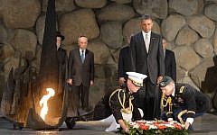 Illustrative: US President Barack Obama pays his respects in the Hall of Remembrance as marines lay a wreath on his behalf during a visit to the Yad Vashem Holocaust Museum on March 22, 2013 (photo credit: Amos Ben Gershom/GPO/Flash90)