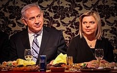 Prime Minister Benjamin Netanyahu and his wife Sara celebrate the Mimouna in Or Yehuda in April 2013. (photo credit: Avishag Shaar Yashuv/Flash90)