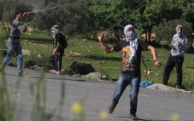 Palestinian protesters clash with Israeli security forces (not seen) during clashes following a protest against the death of a Palestinian prisoner Maysara Abuhamdia while in Israeli detention, April 3, 2013. (photo credit: Issam Rimawi/FLASH90)