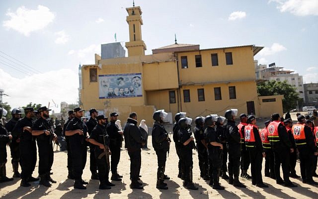 Hamas security forces prepare for a fake funeral in Gaza for Maysara Abuhamdia on Thursday; the actual funeral took place in the West Bank. (photo credit: Wissam Nassar/Flash90) Hamas security forces prepare for a fake funeral in Gaza for Maysara Abuhamdia on Thursday; the actual funeral took place in the West Bank. (photo credit: Wissam Nassar/Flash90)