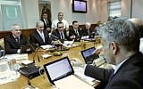 Ministers test drive their new tablet computers at the start of the weekly Cabinet meeting April 7 (photo credit: Alex Kolomoisky/Flash90)