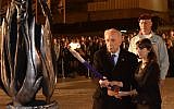 President Shimon Peres lights a torch in memory of Israel's fallen at a memorial ceremony in front of the Western Wall in Jerusalem, Sunday, April 14, 2013 (photo credit: Mark Neyman/GPO/Flash90)