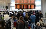 Illustrative: Travelers standing in line at the departure hall at Terminal 1 of Ben Gurion International Airport (Yossi Zeliger/Flash90)