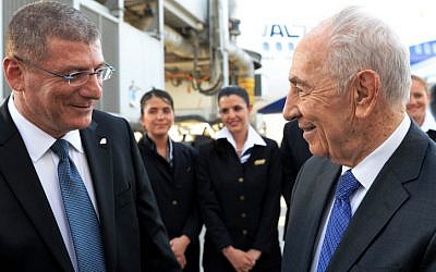 President Shimon Peres seen with El Al CEO Eliezer Shkedi before boarding a plane on his way for an official visit with the Pope in Rome, Italy, April 29. (photo credit: Kobi Gideon/GPO/Flash90)
