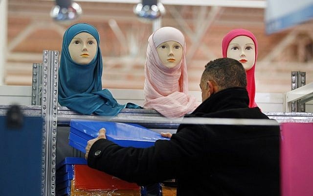 A vendor sets up his stall on the first day of the 30th Annual Meeting of France's Muslims, at Le Bourget, Europe's largest and most popular Muslim convention, Friday, on the fringes of the Parisian suburb of Le Bourget. (AP Photo/Remy de la Mauviniere) A vendor sets up his stall on the first day of the 30th Annual Meeting of France's Muslims, at Le Bourget, Europe's largest and most popular Muslim convention on the fringes of the Parisian suburb of Le Bourget. (AP Photo/Remy de la Mauviniere)