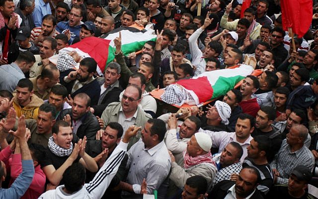 Palestinians carry the bodies of Amer Nassar, 17, and Naji Belbisi, 18, during their funeral in the West Bank village of Anabta near Tulkarem, April 4, 2013. (photo credit: Issam Rimawi/Flash90) Palestinians carry the bodies of Amer Nassar, 17, and Naji Belbisi, 18, during their funeral in the West Bank village of Anabta near Tulkarem, April 4, 2013. (photo credit: Issam Rimawi/Flash90)