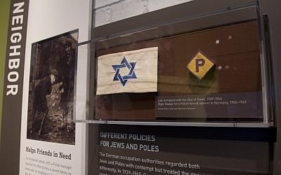 An armband with the Star of David and a badge for a forced laborer in Germany at the United States Holocaust Memorial Museum. (photo credit: AP Photo/Carolyn Kaster)