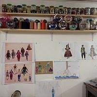Spools of thread and etchings on Wise's studio walls (photo credit: Jessica Steinberg/Times of Israel)