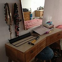 Another one of Shira Wise's flea market finds, with sideways drawers that offer ample hiding space (photo credit: Jessica Steinberg/Times of Israel)
