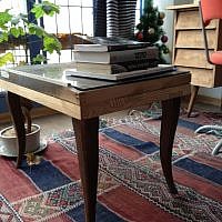 Another flea market find, this time a curio table donated by a friend (photo credit: Jessica Steinberg/Times of Israel)