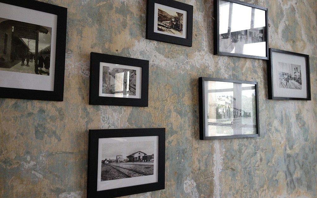Historical photos of times past on the carefully conserved walls of the Jerusalem Train Station (photo credit: Jessica Steinberg/Times of Israel)