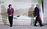EU foreign policy chief Catherine Ashton, left, smiles, as Secretary of Iran’s Supreme National Security Council Saeed Jalili walks away, after a photo op at the start of high-level talks between world powers and Iranian officials in Almaty, Kazakhstan, on Friday. (photo credit: AP/Shamil Zhumatov, Pool)
