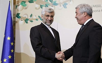 Saeed Jalili, secretary of Iran’s Supreme National Security Council, left, shakes hands with Kazakhstan's Foreign Minister Yerlan Idrisov in Almaty on Friday. (photo credit: AP/Shamil Zhumatov, Pool)