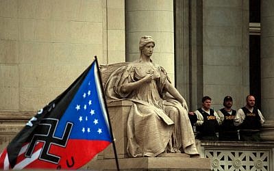 A Klan swastika flag rising next to the Shelby County Courthouse in Memphis, Tenn., March 30, 2013. (Blake Billings)