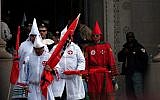 Klansmen exiting the Shelby County Courthouse in Memphis, Tennessee, moments before their rally, March 30, 2013. (photo credit: JTA/Blake Billings)