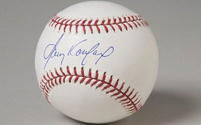 A baseball signed by Sandy Koufax is displayed in the National Museum of American Jewish History in Philadelphia. (photo credit: Courtesy National Museum of American Jewish History/JTA)