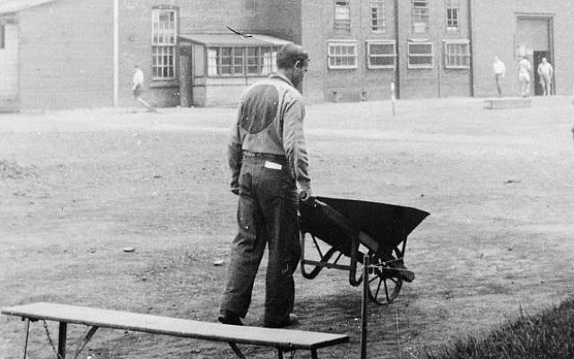Photograph of an internee in a camp uniform, taken by internee Marcell Seidler, Camp N in Sherbrooke, Quebec, circa 1940-1942. Seidler secretly documented camp life using a handmade pinhole camera. (photo credit: Marcell Seidler/Courtesy Eric Koch/Library and Archives Canada) Photograph of an internee in a camp uniform, taken by internee Marcell Seidler, Camp N in Sherbrooke, Quebec, circa 1940-1942. Seidler secretly documented camp life using a handmade pinhole camera. (photo credit: Marcell Seidler/Courtesy Eric Koch/Library and Archives Canada)
