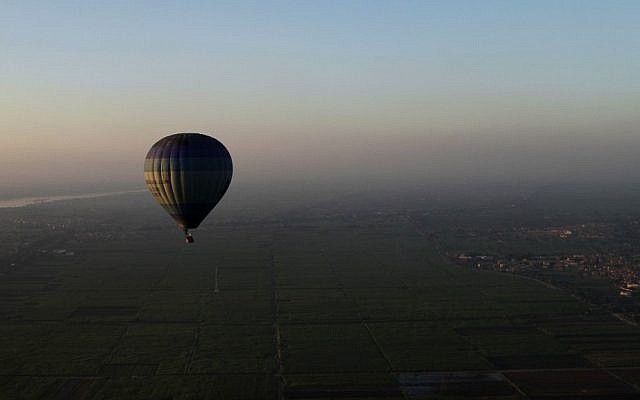 A hot-air balloon flies over the city of Luxor, Egypt, 2012. (photo credit: AP/Nariman El-Mofty)