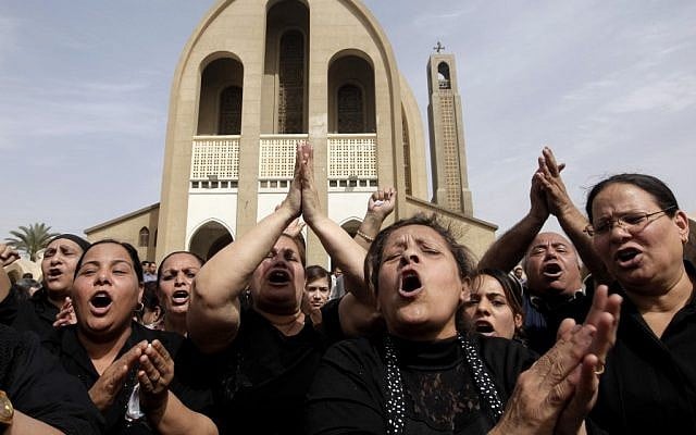 Egyptian Christians chant anti-Muslim Brotherhood slogans following a funeral service at the Saint Mark Coptic cathedral in Cairo, Egypt, Sunday, April 7, 2013. (photo credit: AP/Amr Nabil) Egyptian Christians chant anti-Muslim Brotherhood slogans following a funeral service at the Saint Mark Coptic cathedral in Cairo, Egypt, Sunday, April 7, 2013. (photo credit: AP/Amr Nabil)