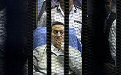 Egypt's deposed president Hosni Mubarak attends a hearing session in his retrial on appeal in Cairo, Egypt, Monday, April 15, 2013 (photo credit: AP/Ahmed Gomaa)