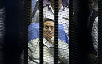 Egypt's deposed president Hosni Mubarak attends a hearing session in his retrial on appeal in Cairo, Egypt, Monday, April 15, 2013 (photo credit: AP/Ahmed Gomaa)