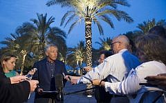 Chuck Hagel speaking with reporters after reading a statement on chemical weapon use in Syria during a press conference in Abu Dhabi on Thursday. (photo credit: AP/Jim Watson, Pool)