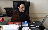 In this undated photo, former Iranian president Mohammad Khatami watches a video on his laptop in his office in Tehran, Iran. Many reformists are expected to sit out the June 14 voting in a silent protest over the crackdowns that have left them leaderless and demoralized. Others unwilling to boycott the election are rallying around a last-ditch call for help to Khatami, who is seen increasingly as their only credible hope at the ballot box. (AP Photo/Office of Mohammad Khatami, Asghar Khaksar)