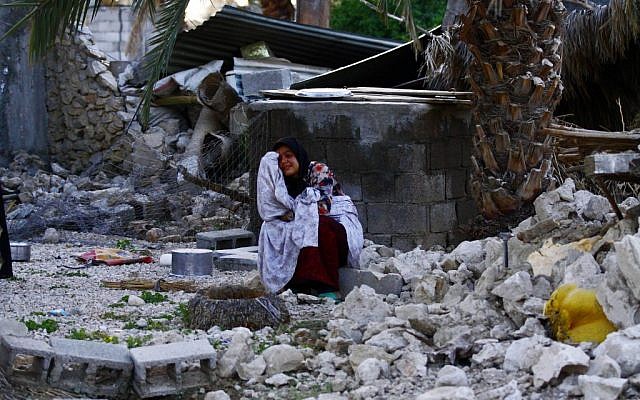 An Iranian woman reacts as she sits among the rubble of buildings after an earthquake struck southern Iran, in Shonbeh, Iran in April. (photo credit: AP/Fars News Agency, Mohammad Fatemi) An Iranian woman reacts as she sits among the rubble of buildings after an earthquake struck southern Iran, in Shonbeh, Iran in April. (photo credit: AP/Fars News Agency, Mohammad Fatemi)