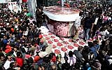 5-ton tub of ice-cream made by Iranian Choopan dairy is displayed during a ceremony at the Tochal mountainous area of northern Tehran, Iran, Monday, April 1 (photo credit: AP/Ebrahim Noroozi)