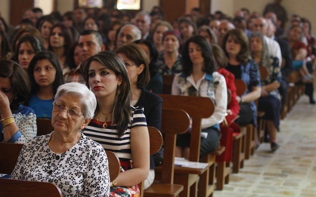 Iraqi Christians pray during Easter mass at Mar Youssif Chaldean Church in Baghdad on Sunday. The Chaldean Church is an Eastern Rite church affiliated with the Roman Catholic Church. (photo credit: AP Photo/ Karim Kadim) Iraqi Christians pray during Easter mass at Mar Youssif Chaldean Church in Baghdad on Sunday. The Chaldean Church is an Eastern Rite church affiliated with the Roman Catholic Church. (photo credit: AP Photo/ Karim Kadim)