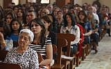 Iraqi Christians pray during Easter mass at Mar Youssif Chaldean Church in Baghdad on Sunday. The Chaldean Church is an Eastern Rite church affiliated with the Roman Catholic Church. (photo credit: AP Photo/ Karim Kadim)