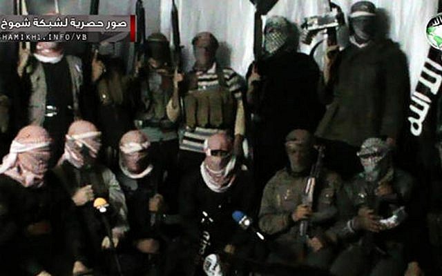 This undated image posted on a militant website purports to show militants in the al-Jazeera region on the Iraqi side of the Syria-Iraq border (photo credit: AP) This undated image posted on a militant website purports to show militants in the al-Jazeera region on the Iraqi side of the Syria-Iraq border (photo credit: AP)