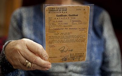 Aliza Vitis-Shomron holds a certificate from 1943. (Photo credit: AP/Ariel Shalit)